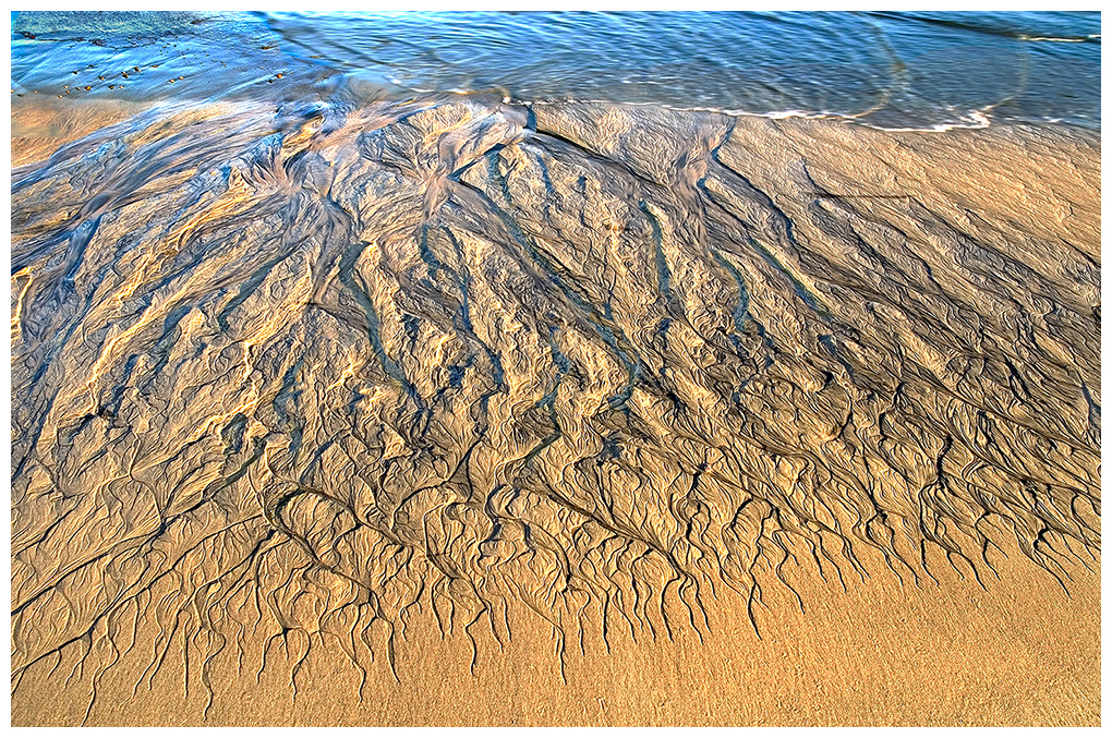 Beach at Baja Ca. As the tide withdraws, it leaves grooves in the sand creating a beautiful design.