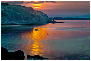 Fishing boat returning to port in Collioure, France