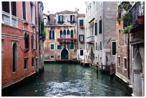 Canal in Venice showing the balconies full of flowers