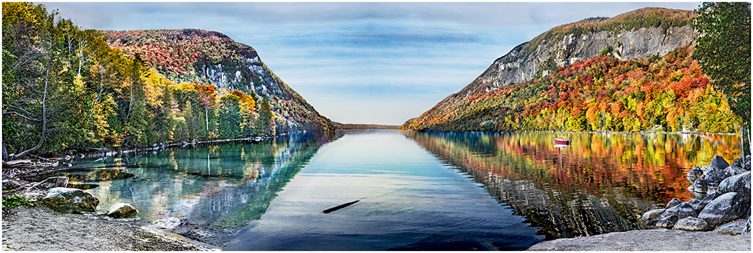 Lake Willoughby surrounded  by color aspen.